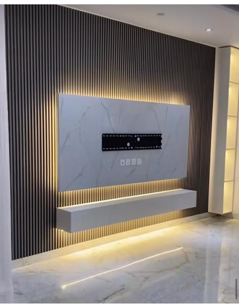 Fluted wall panel TV wall with backlighting