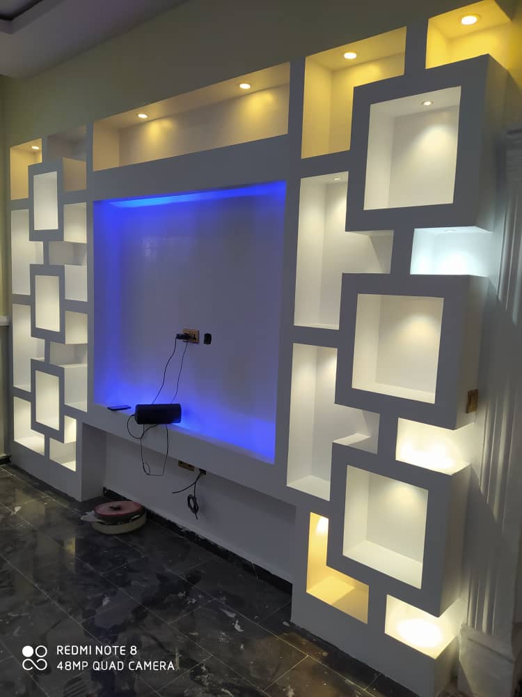 POP ceiling and TV wall unit finished by Ajis Interior Creations